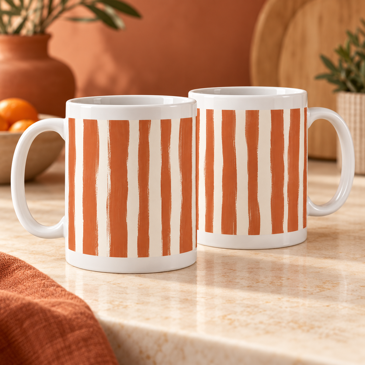 Two white ceramic mugs with terracotta brush-painted stripes and cream gaps