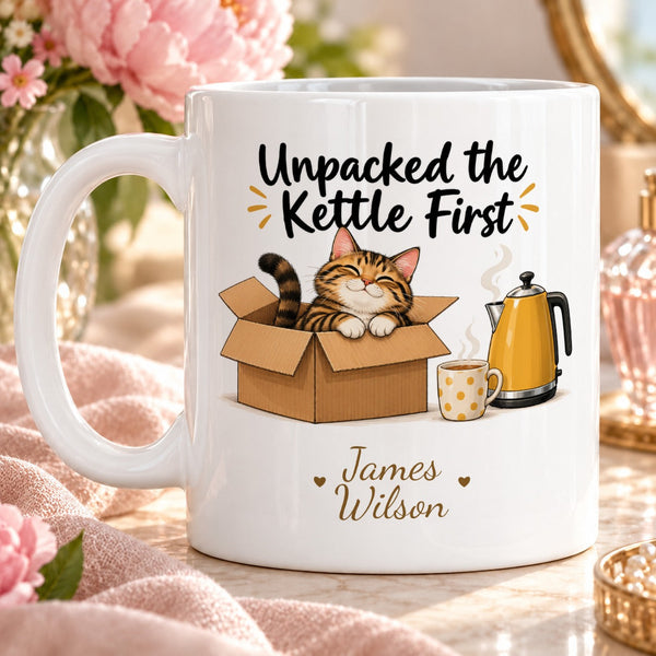 Unpacked the Kettle First – Personalised Mug — funny cartoon tabby cat sitting in open moving box beside a mustard kettle and a cup