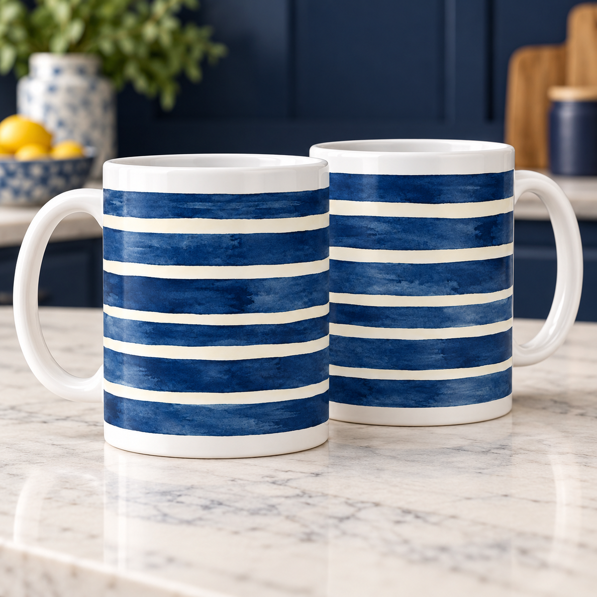 Two white ceramic mugs with textured indigo horizontal bands and ivory stripes